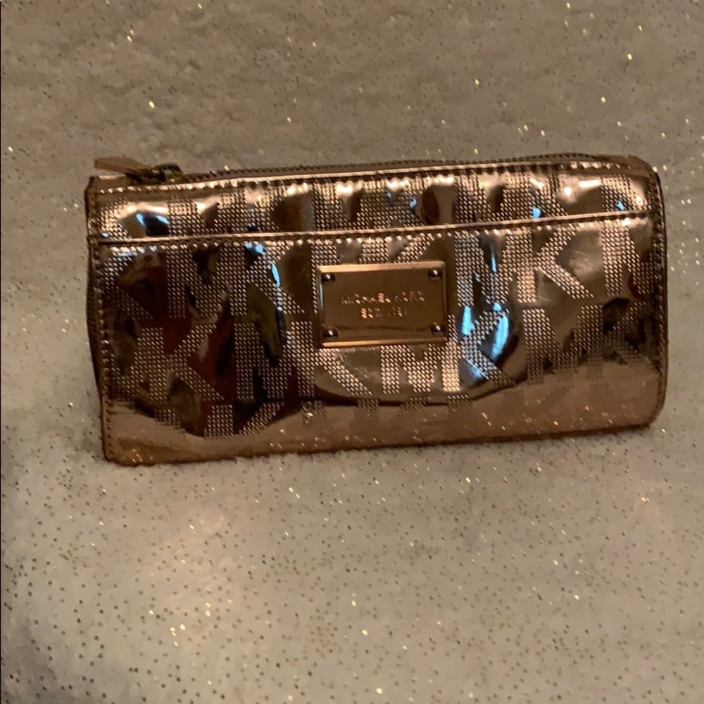 Metallic rose color makeup bag.